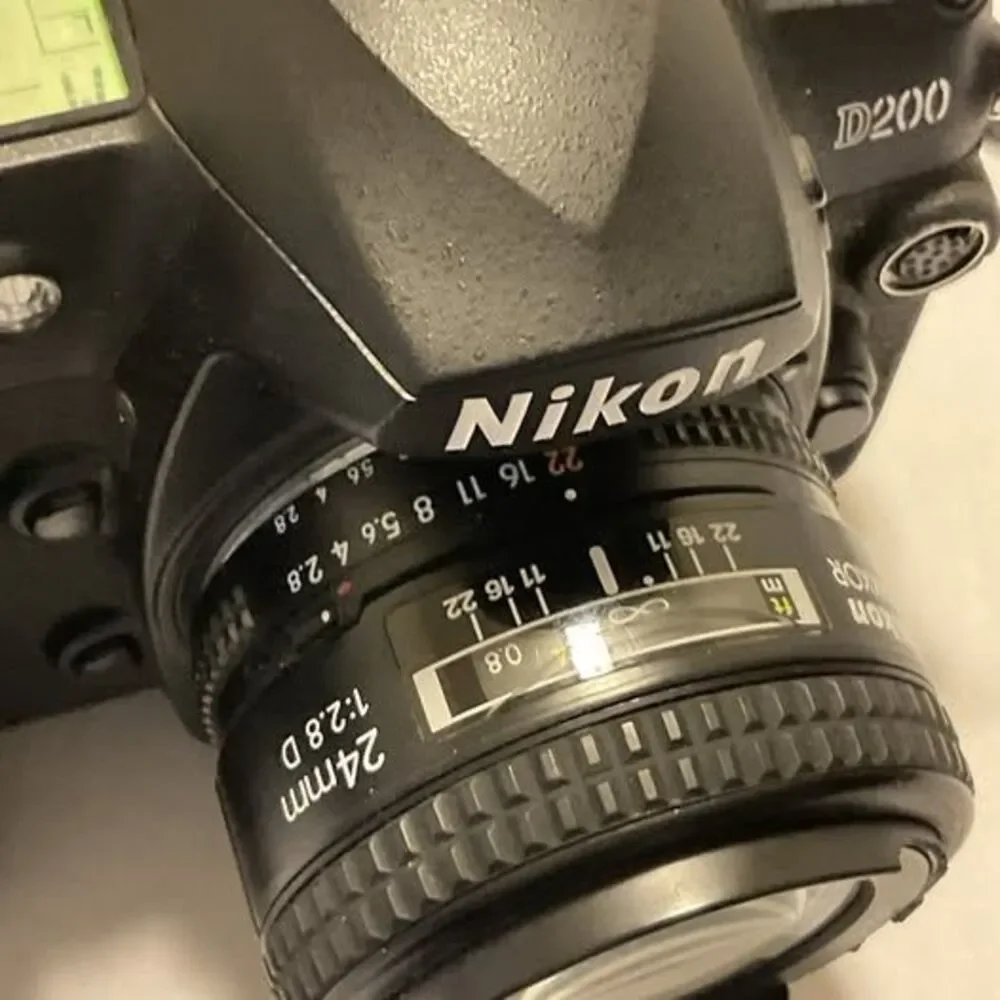 Nikon DS200 24 Mm Lens Plus Trigger 2 Batteries And Accessories